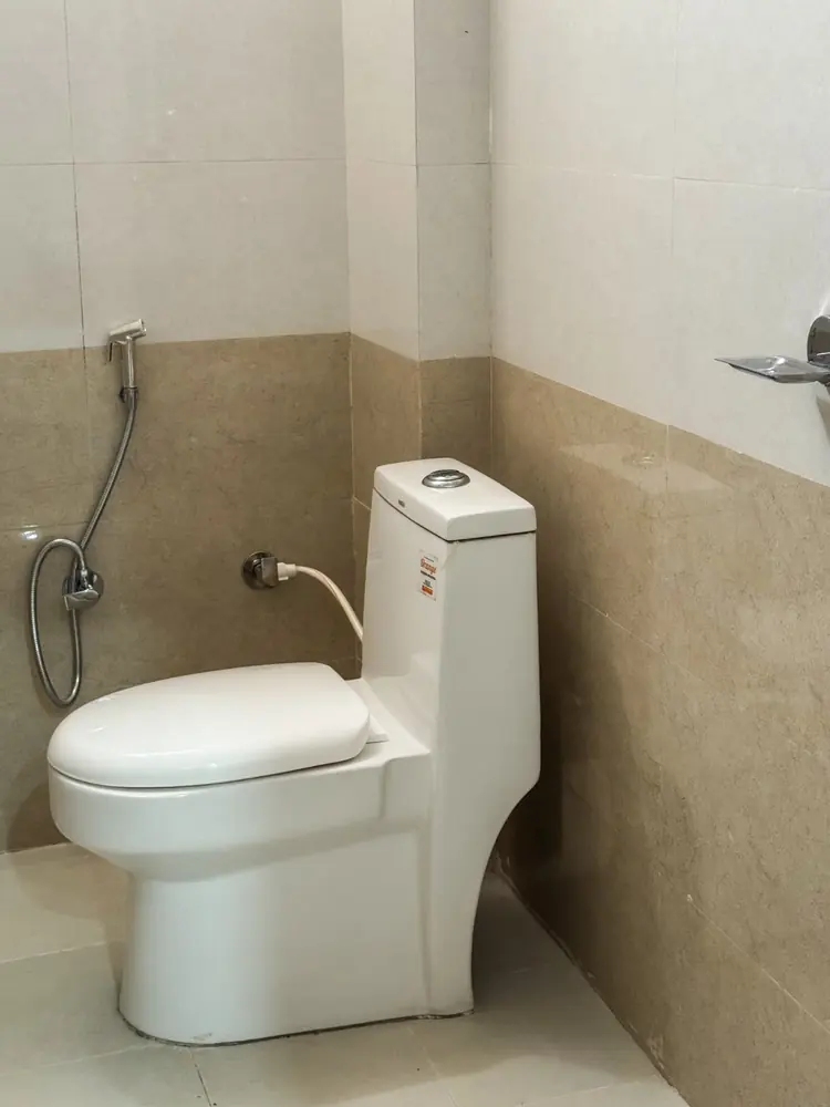 Clean private bathroom with western toilet