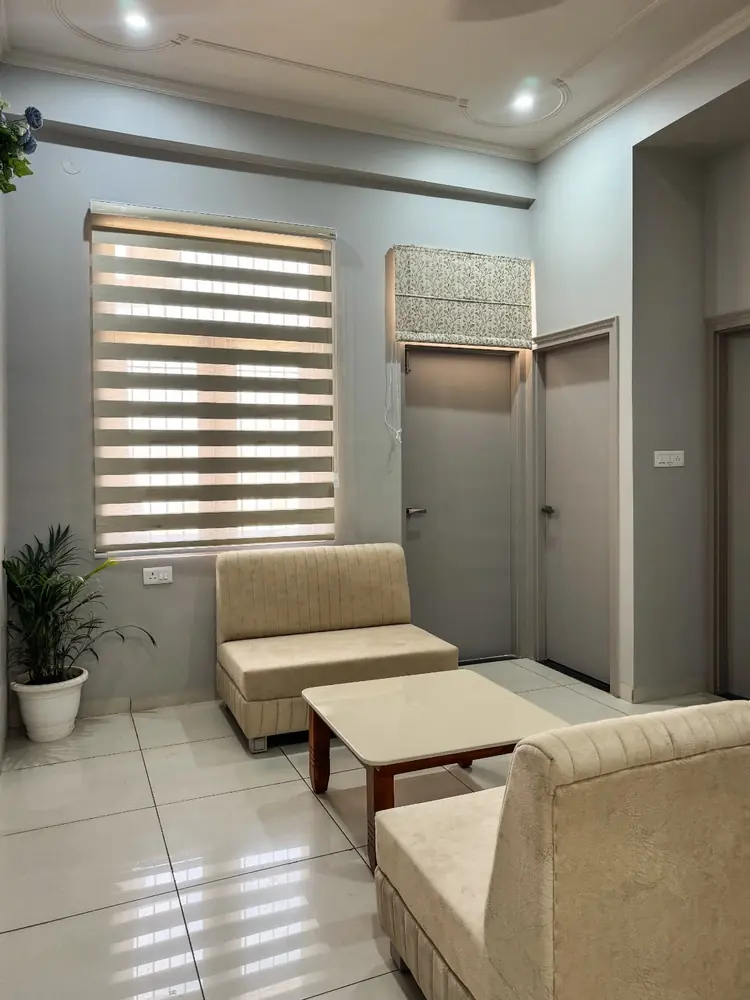 Sitting area with sofas beside a bright window